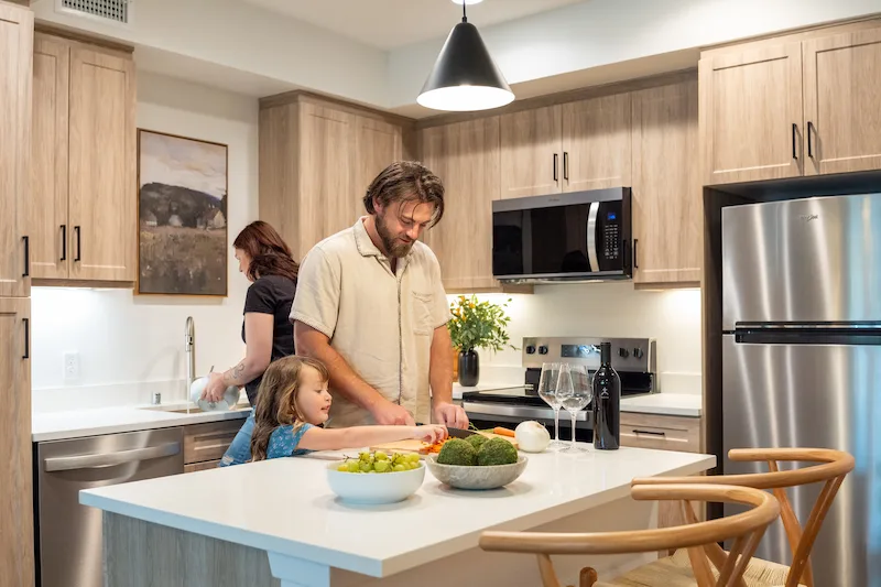 Family Cooking Dinner in Terra Vista Apartment Kitchen