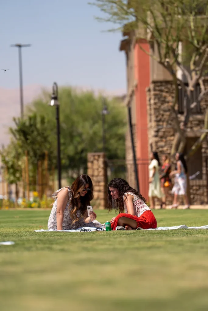 Girls Having Picnic on Grass Field