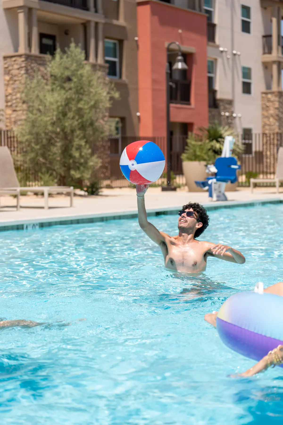 Man Playing with Beach Ball in Terra Vista Apartments