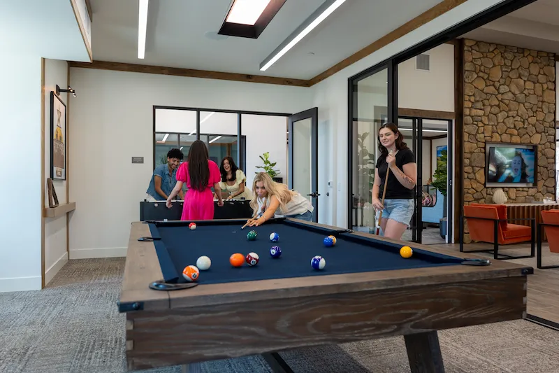 Tenants Playing Billiards Table at Terra Vista