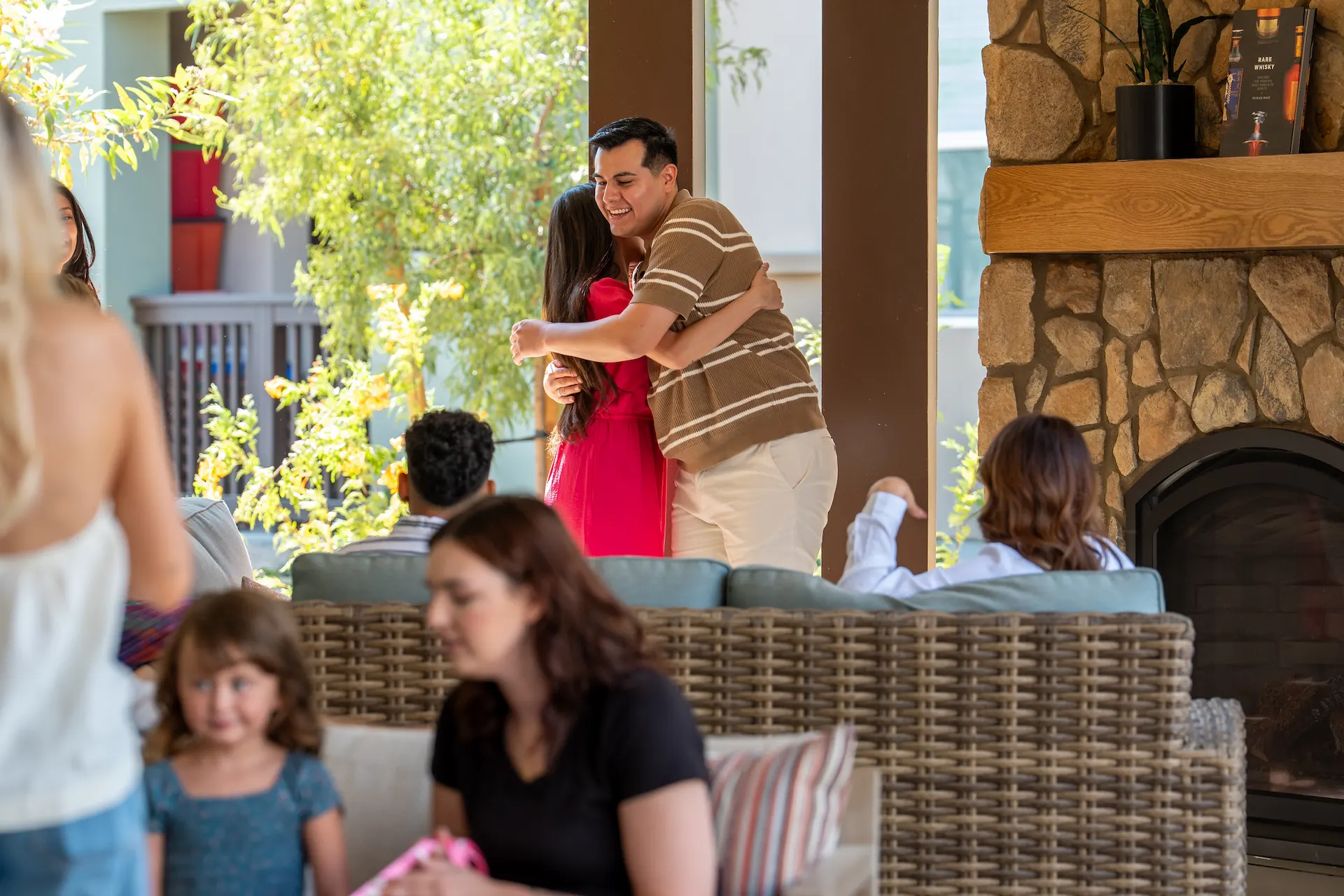 Man hugging woman in a party at Terra Vista